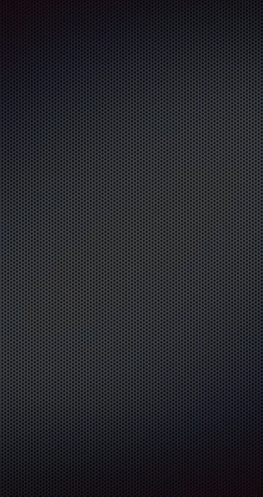 A dense mesh of tiny dots covers a charcoal field, lit slightly brighter down the middle and fading to black at both side edges.