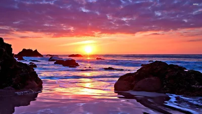 Pink Evening Sky Over a Rocky Shore HD Wallpaper