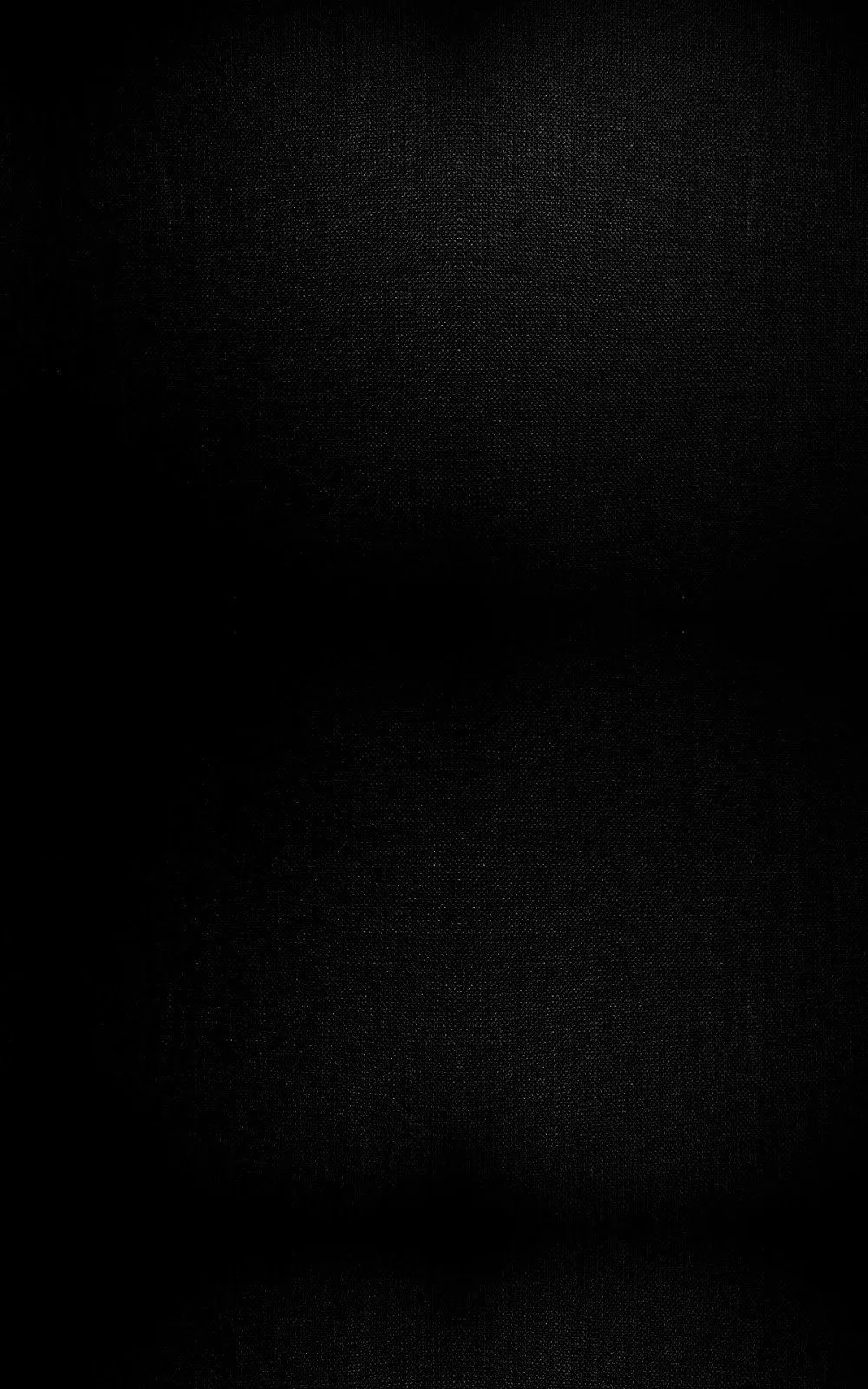 An almost pure black surface with a barely visible fibrous texture and a faint horizontal seam near the middle, reading as true black on OLED phones.