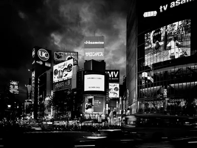 City Billboards under a Stormy Sky HD Wallpaper