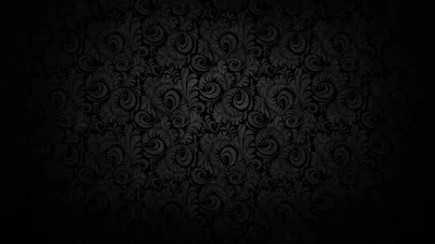A baroque wall pattern shows through in the middle of the frame and dissolves into black toward every corner.