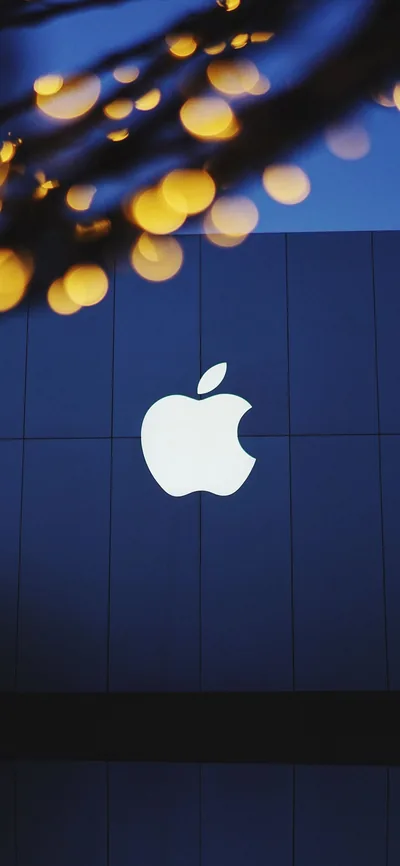 Apple Logo on a Blue Wall at Dusk HD Phone Wallpaper