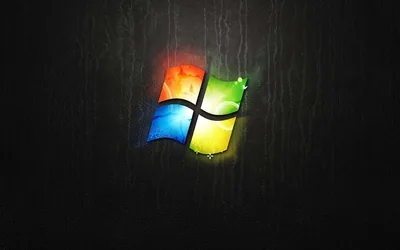 Glowing Windows 7 Logo on a Dark Wall HD Wallpaper