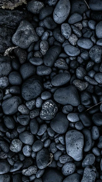 Black Pebbles on a Beach HD Phone Wallpaper