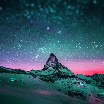 Snowy Peak Under a Green Starry Sky HD Wallpaper