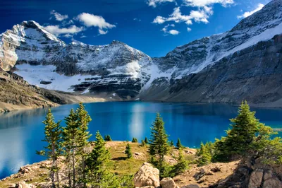 Deep Blue Lake Ringed by Snow Walls HD Wallpaper