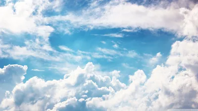 Sunlit Clouds Framing a Blue Sky HD Wallpaper
