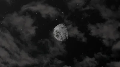 Moon Between Dark Clouds HD Wallpaper