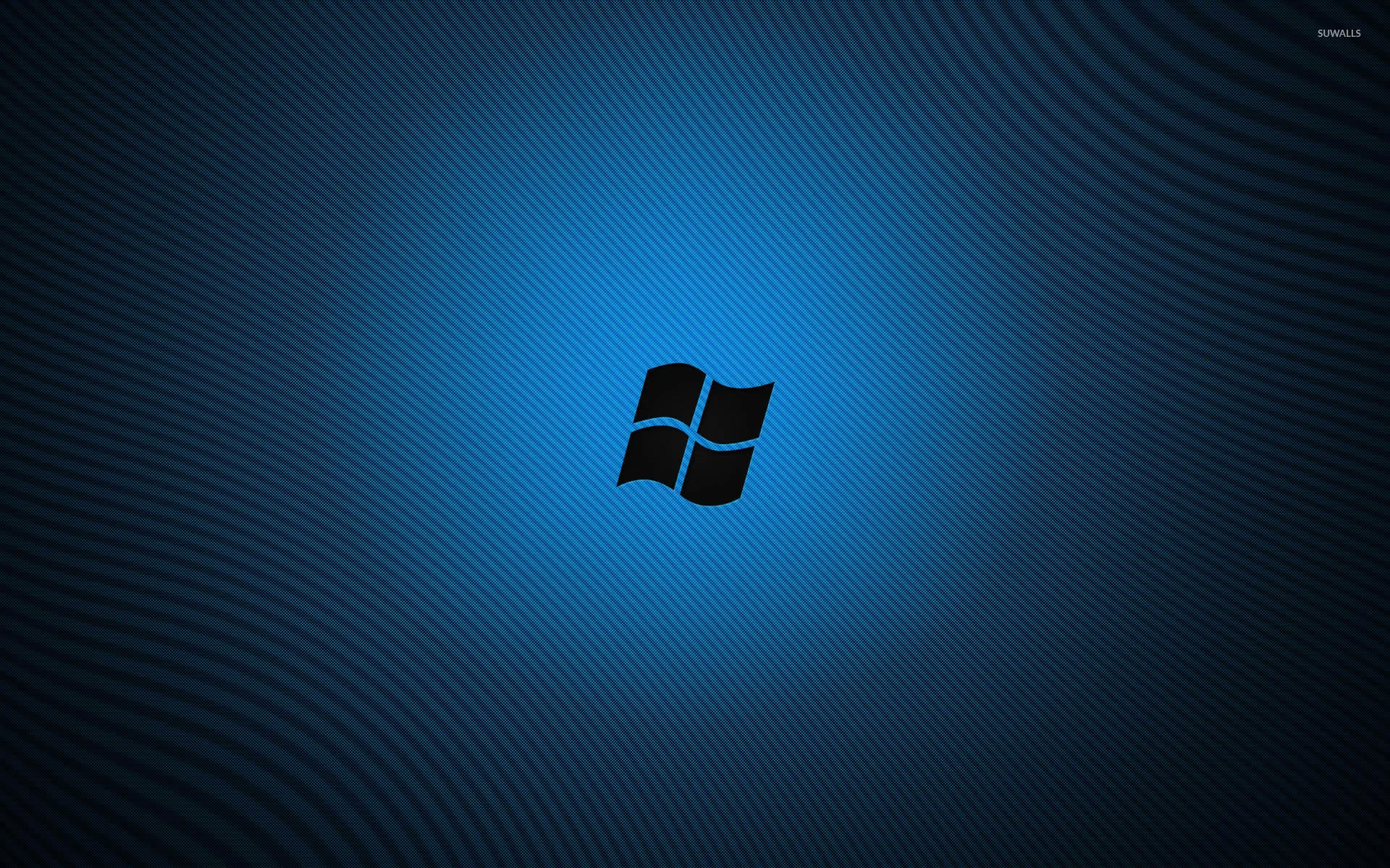 The window mark sits cut out in black on a textured blue field with a soft glow spreading behind it.