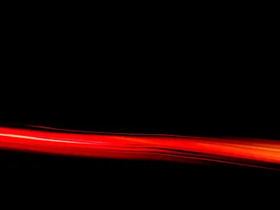 Single Red Light Streak on Black HD Wallpaper