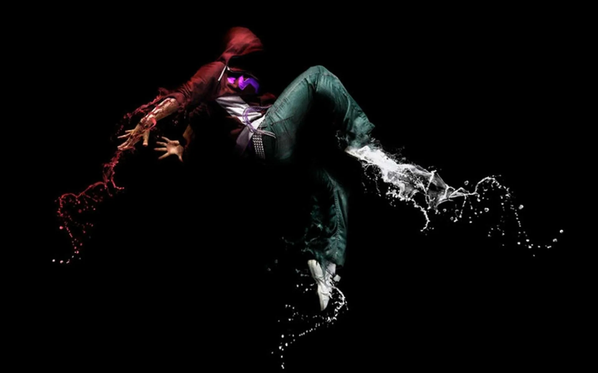 A break-dancer frozen mid-move, the body dissolving into red and white splashes of liquid on a completely black field.