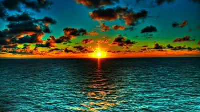 Emerald Sunset Over Rippled Water HD Wallpaper