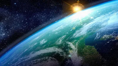 Turquoise Earth Under a Sunburst HD Wallpaper