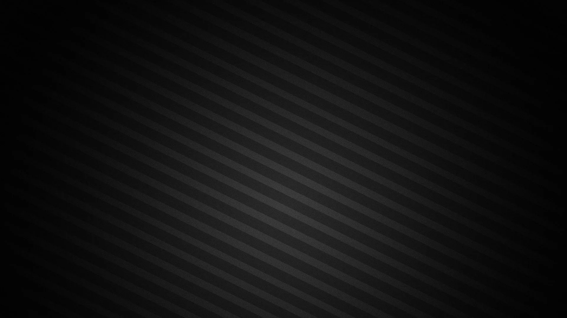Soft grey stripes slant across the frame and fade into black at the left edge, leaving that side clear for desktop icons.