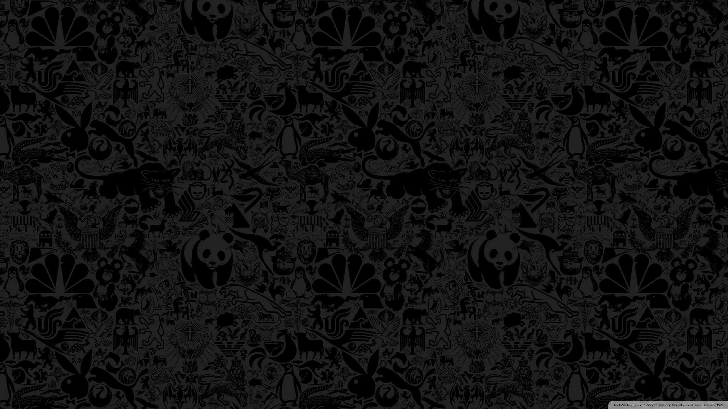 Skulls, hearts, stars and scribbled shapes tile across the frame in a barely lighter black, the pattern reading as texture more than drawing.