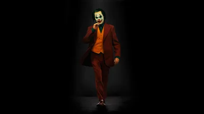 Spotlit Joker in a Red Suit HD Wallpaper