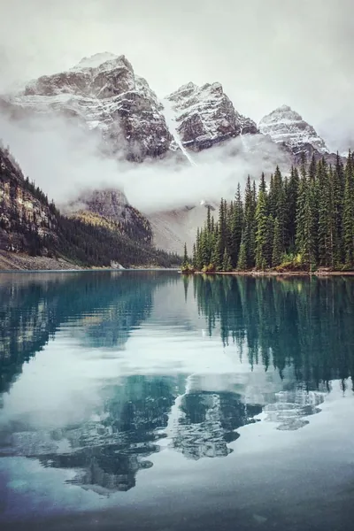 Foggy Peaks Over a Still Blue Lake HD Phone Wallpaper