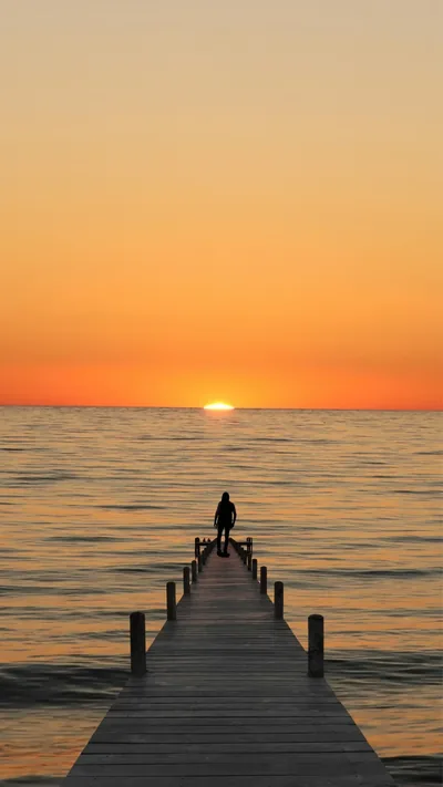Alone on a Jetty at Sunset HD Phone Wallpaper