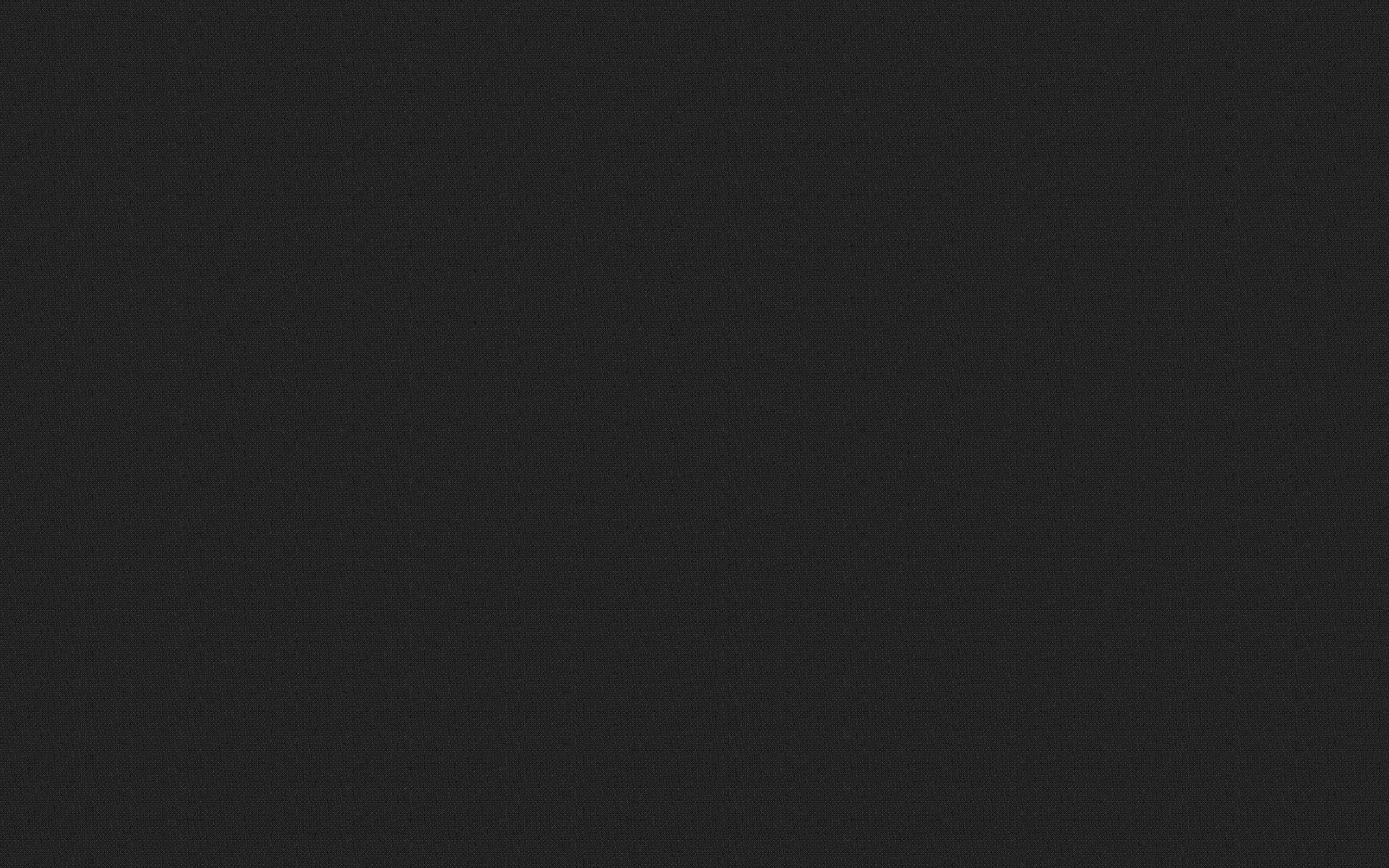A flat dark charcoal fill with nothing in it, soft enough on the eyes to sit behind a full home screen of icons.