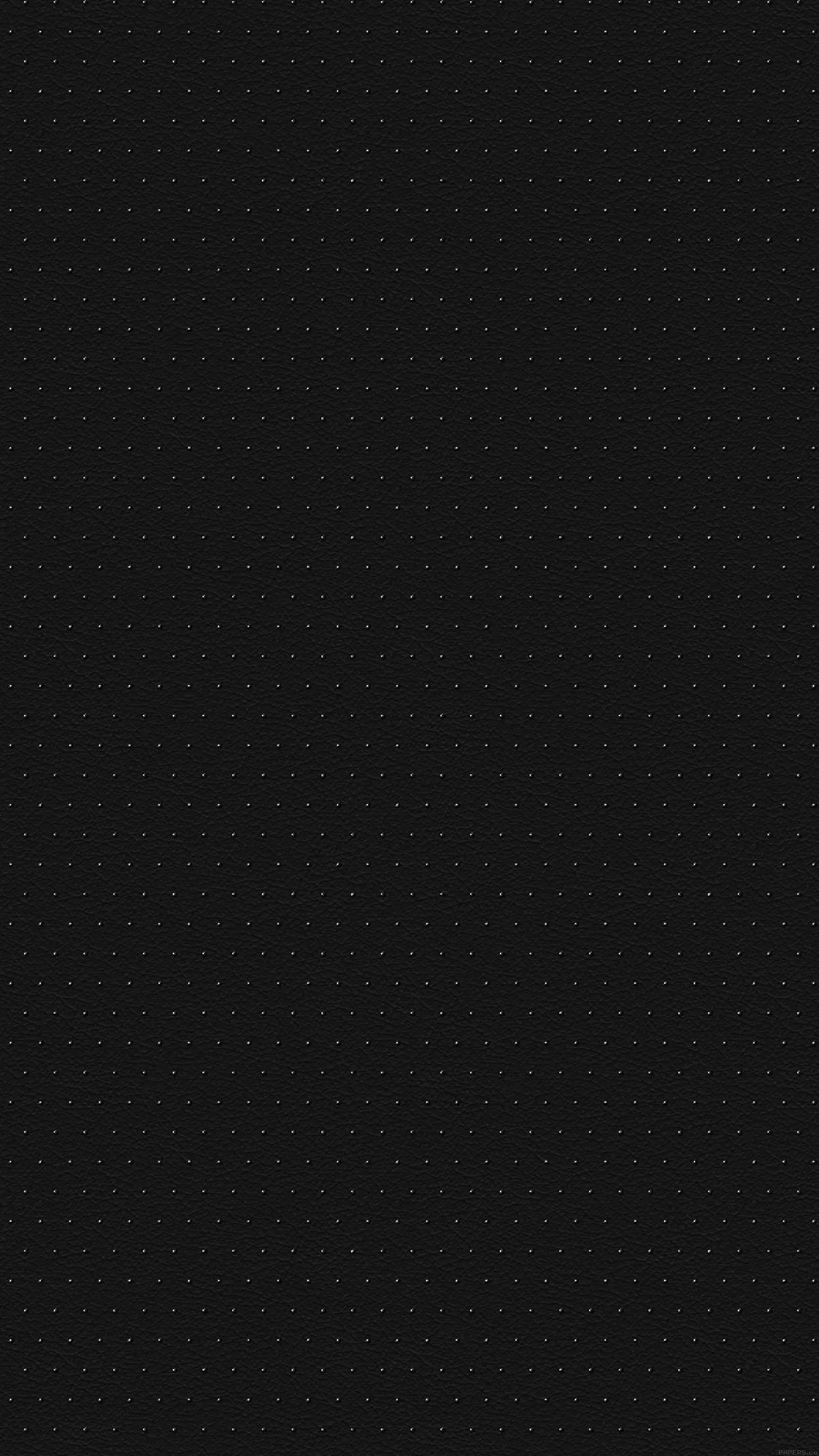 A barely-there grid of pinpoint dots repeats across a graphite ground, even enough that the clock and widgets read cleanly anywhere on screen.