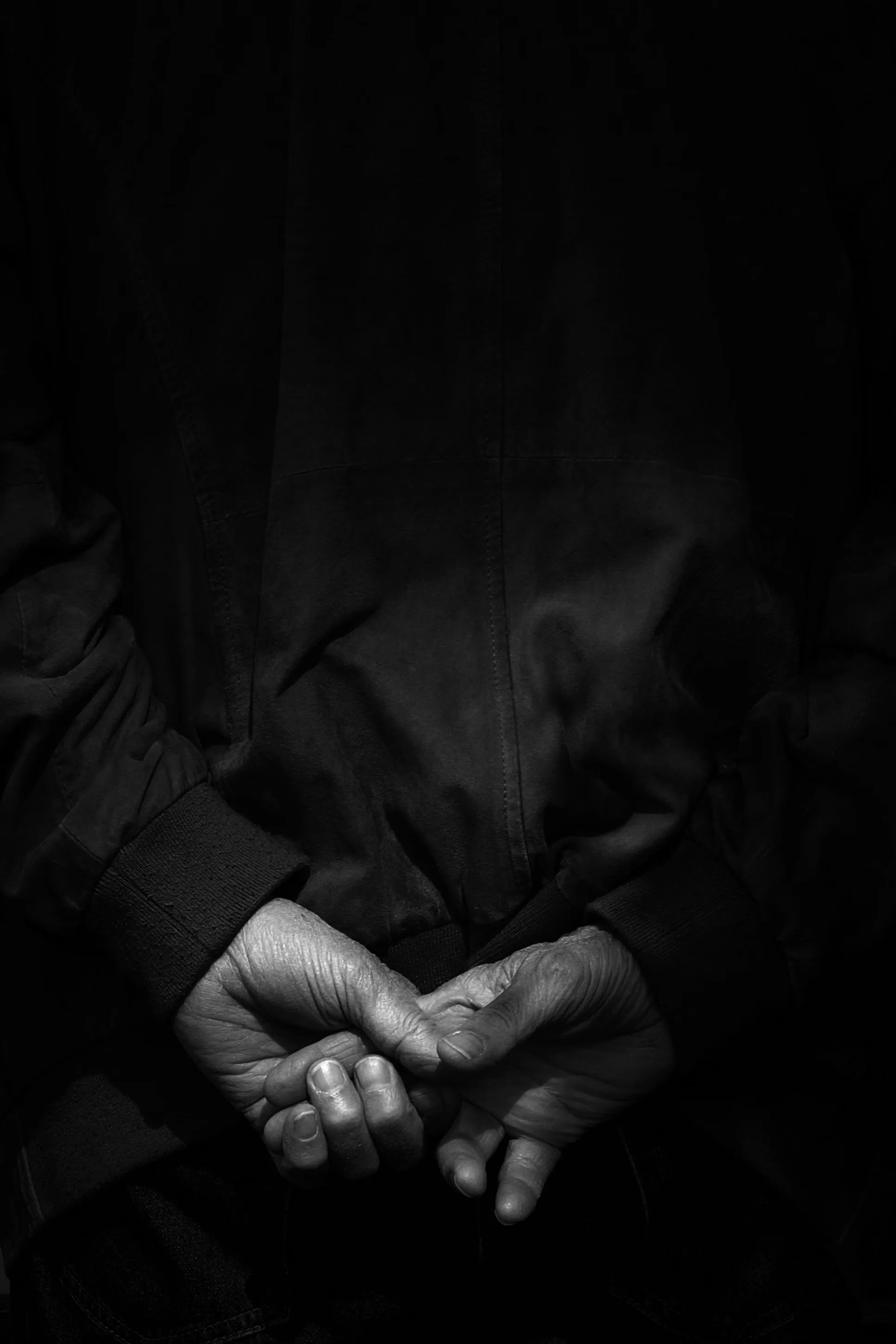Black and White Portrait of Hands in Shadows Free Stock Photo