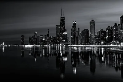 City Skyline Reflected in Water at Night HD Wallpaper