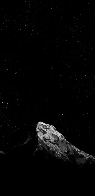 Rocky Peak Under a Star Filled Sky HD Phone Wallpaper