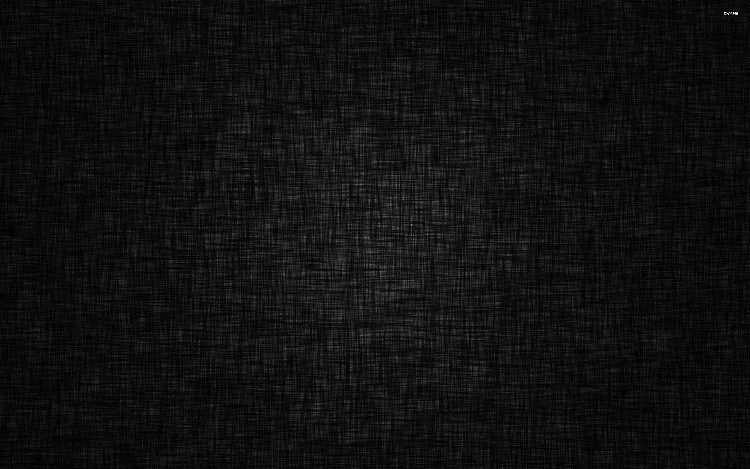 A fine crosshatched weave covers a dark cloth, brightest through the middle and shading into a heavy vignette at the corners.
