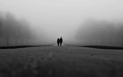 Couple Walking Down a Foggy Road HD Wallpaper