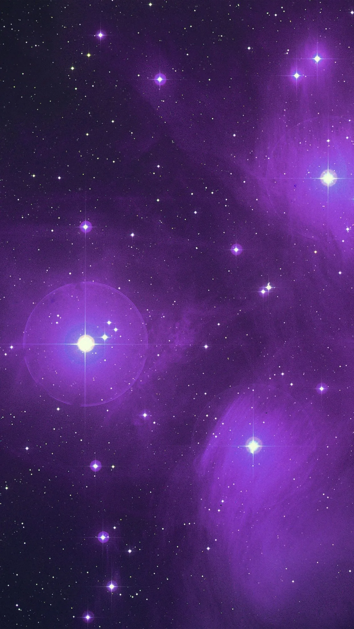 Bright stars with four-point flares sit in a purple cloud, the largest one low on the left, the haze thinning toward the top corners.