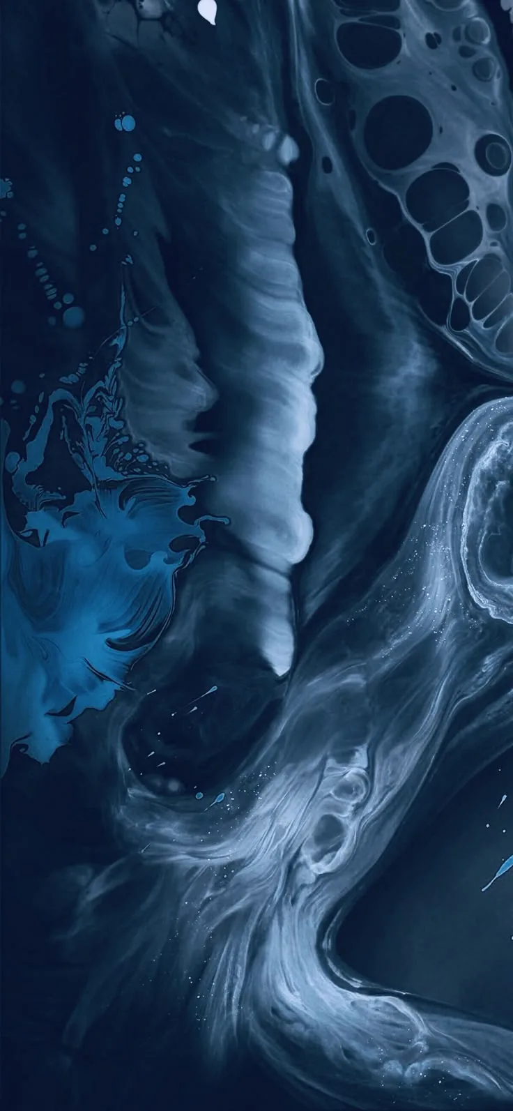A resin pour in navy and slate, a pale column running down the centre with lacy white cells gathered in the upper right corner of the canvas.