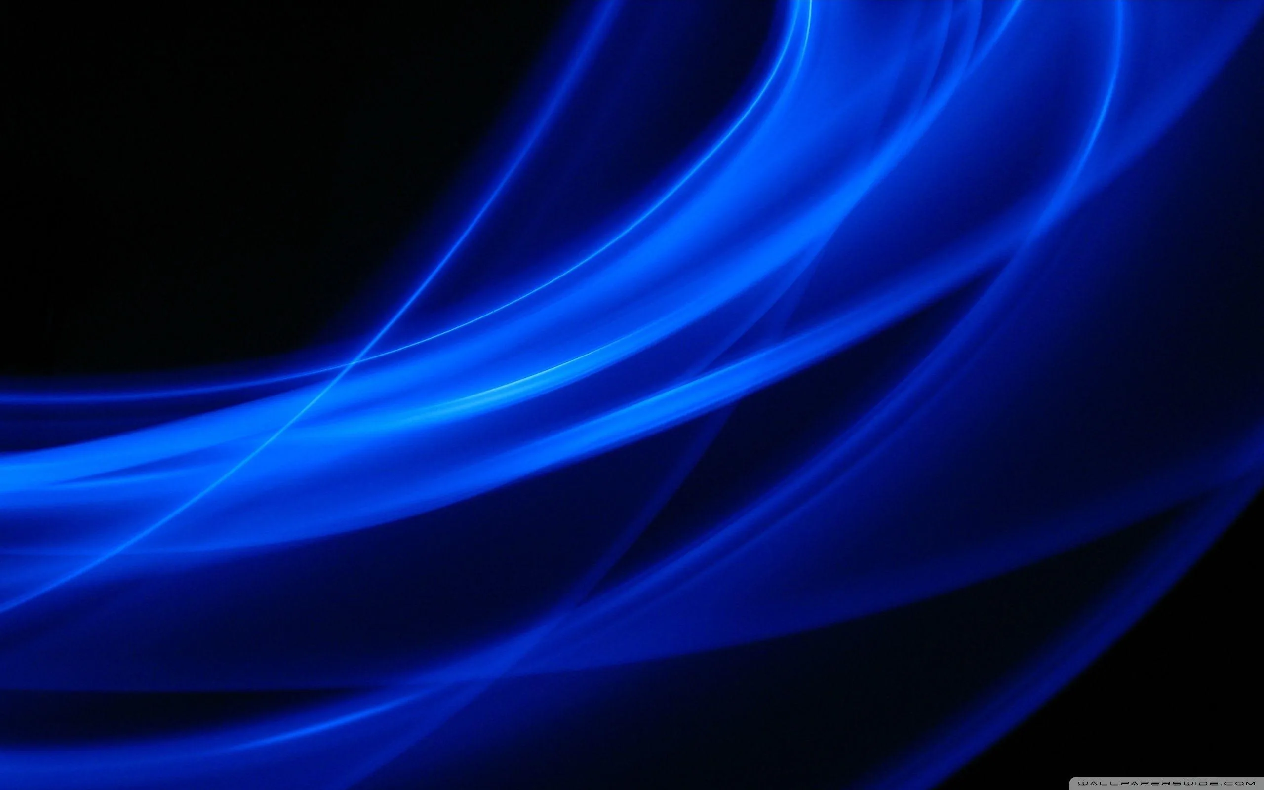 Broad ribbons of glowing blue arc across the lower two thirds of the frame while the top right corner drops into flat black.