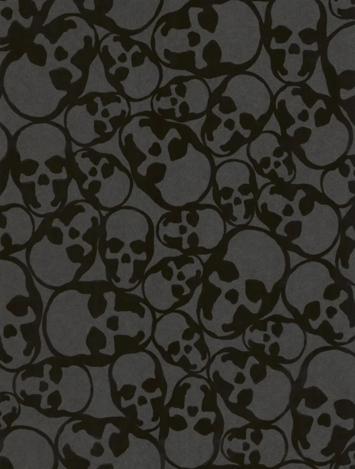 Dozens of hand-drawn skulls overlap edge to edge in two close tones of grey and black, a seamless repeat with no single focal point.