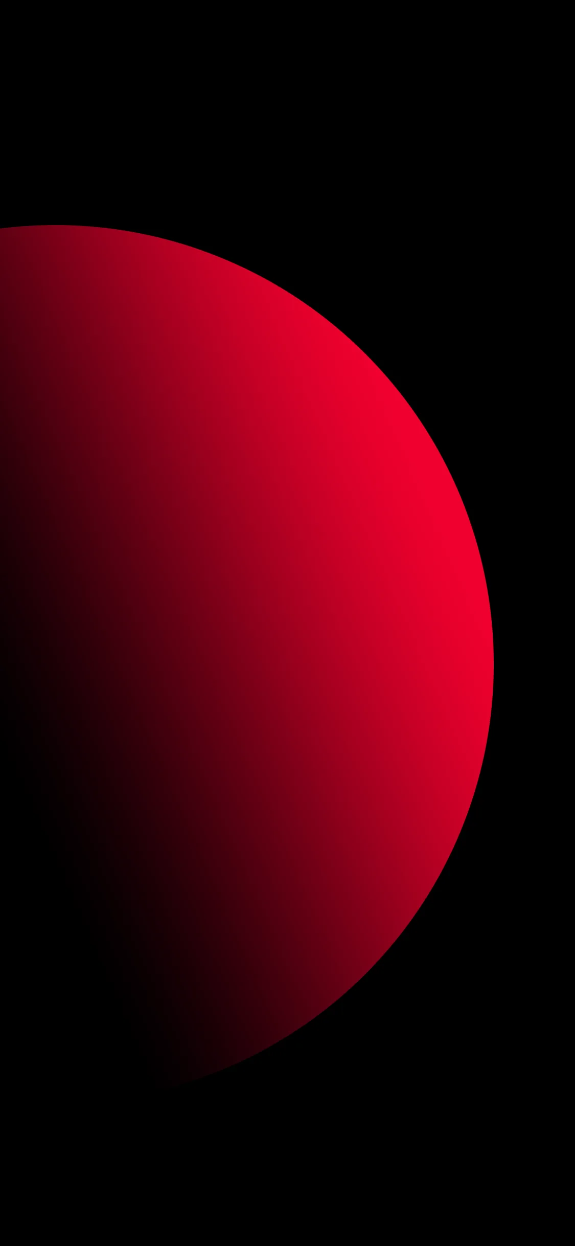 A vast red sphere fills the left of the frame and falls into shadow toward its edge, the rest of the screen left pure black.