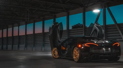 McLaren with Dihedral Doors Up in a Hangar HD Wallpaper