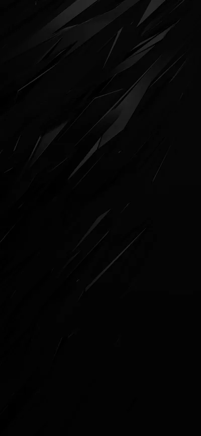 Sharp faceted slivers cut diagonally across a near-black surface, catching just enough grey light to read as glass in a tall frame.