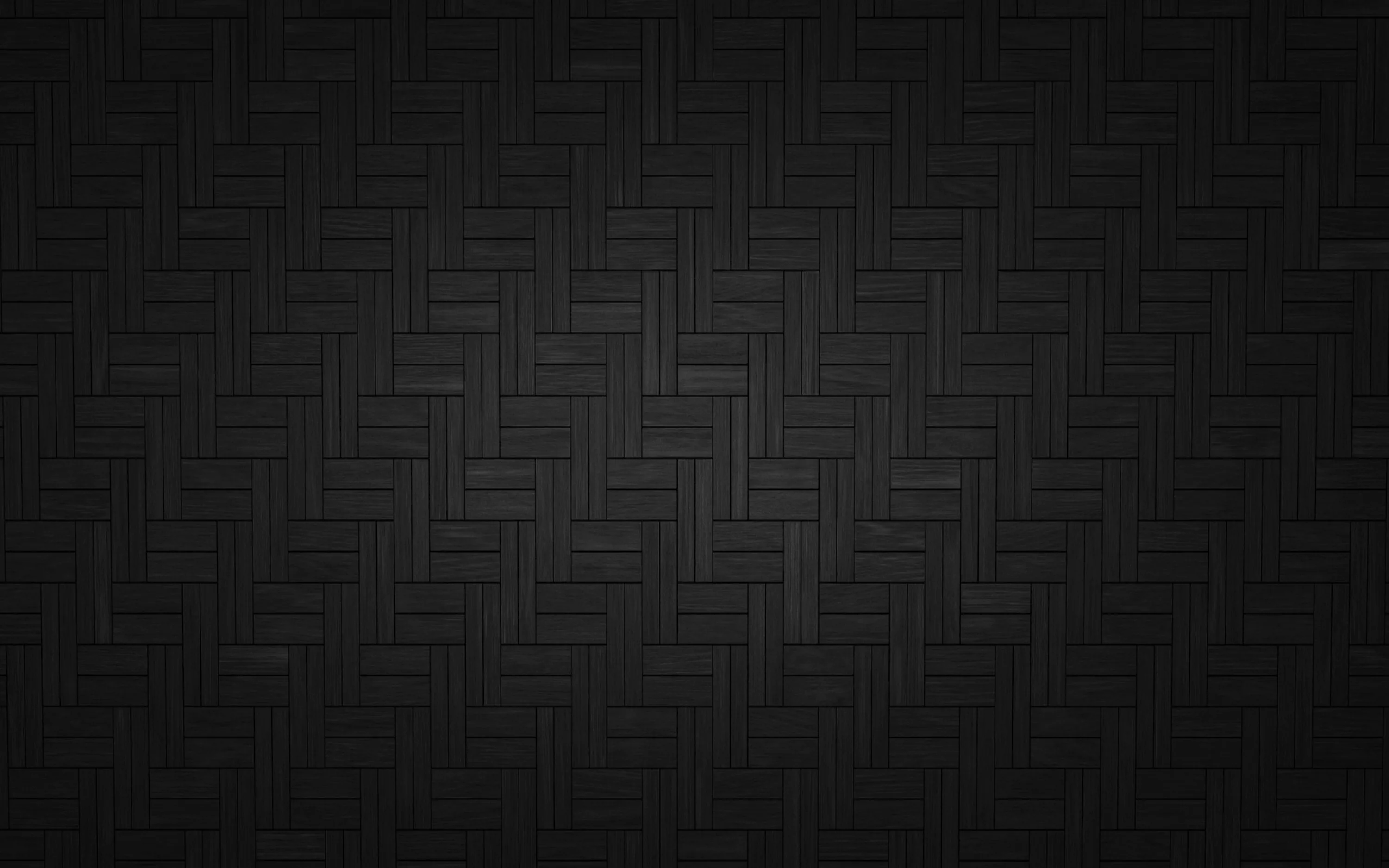 Short bars interlock in a herringbone weave across the frame, the relief picked out in dark grey through the centre while the border falls away to black.