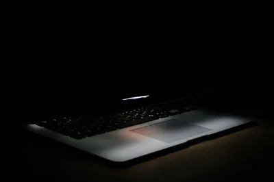 Laptop Edge Lit in a Dark Room HD Wallpaper