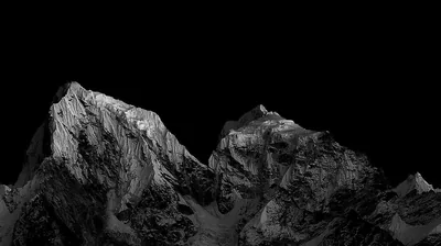 Snow Covered Peaks Against a Black Sky HD Wallpaper