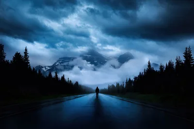 Mountain Road Under Storm Clouds HD Wallpaper