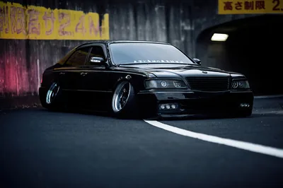 Slammed Black Sedan Under a Tunnel HD Wallpaper
