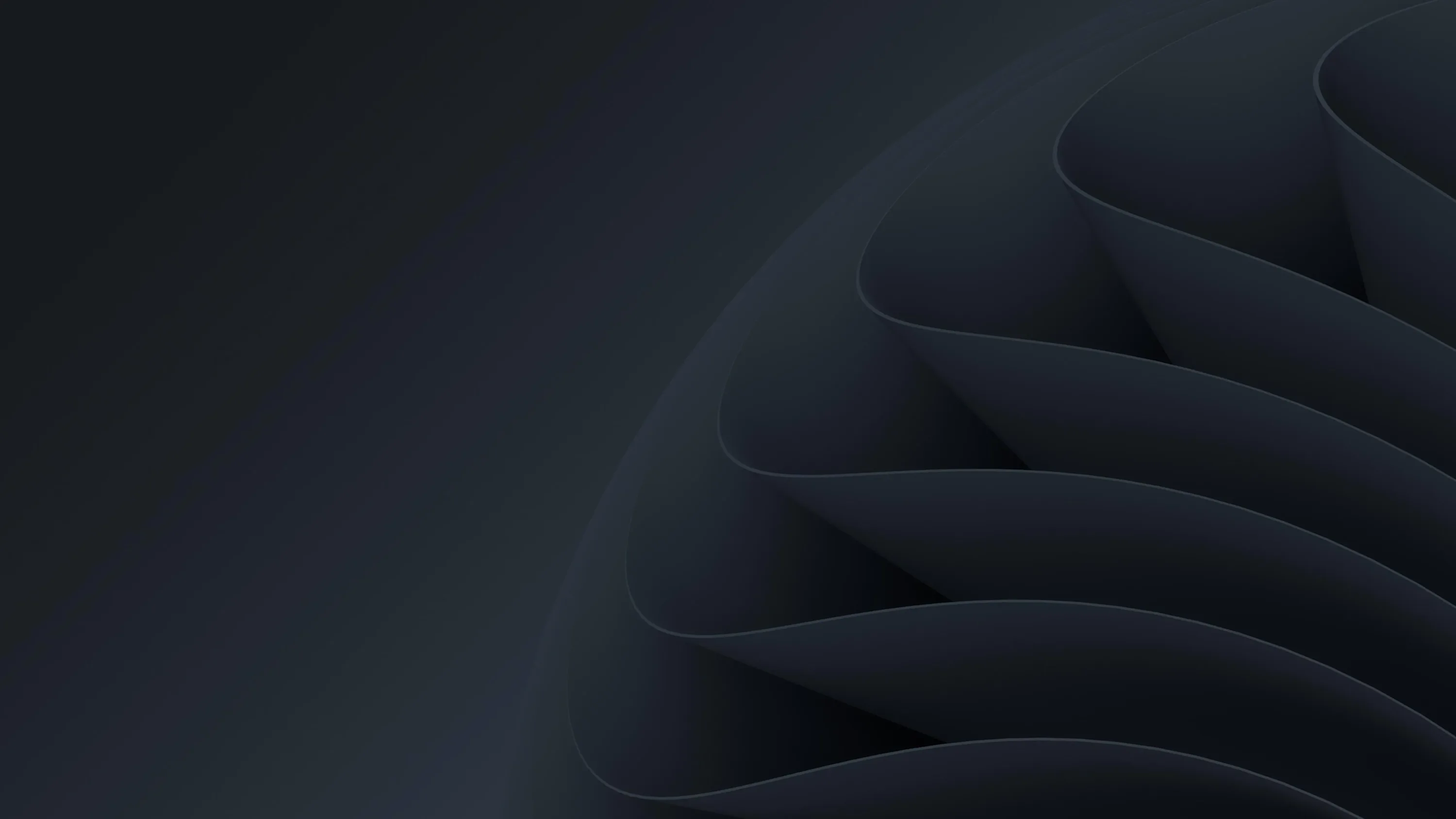 Soft charcoal ribbons fold over one another from the right edge, the left third fading to flat near-black for desktop icons.