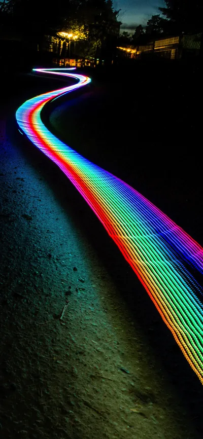 Rainbow Light Trail on a Dark Path HD Phone Wallpaper