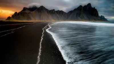 Landscape View Of Mountains Ocean Stream Waves On Black Sand During Sunset 4K HD Nature