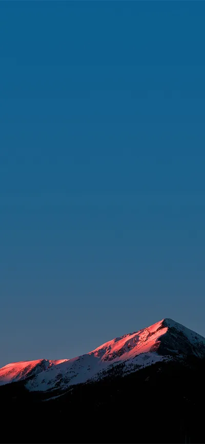 Blue Sky Over a Red-Lit Ridge HD Phone Wallpaper