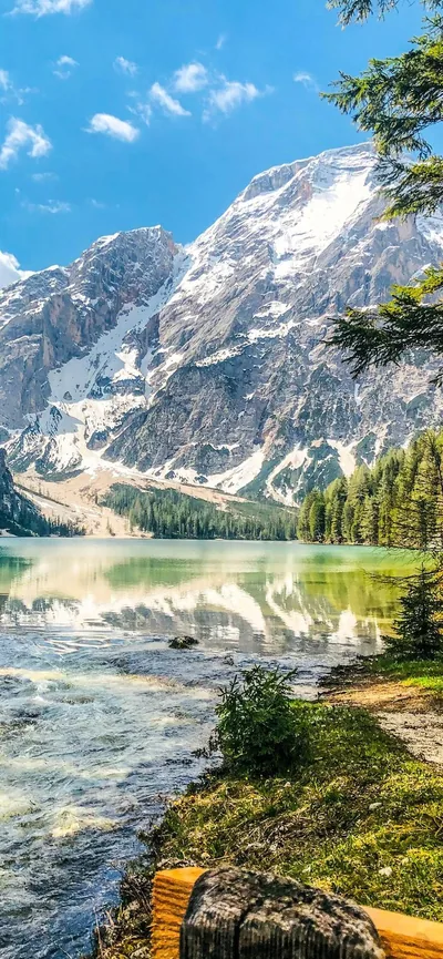 Turquoise Alpine Lake Below a Rock Wall HD Phone Wallpaper