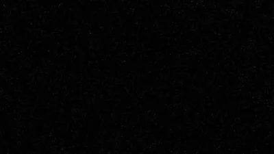 Black Screen with Faint Dust Specks HD Wallpaper