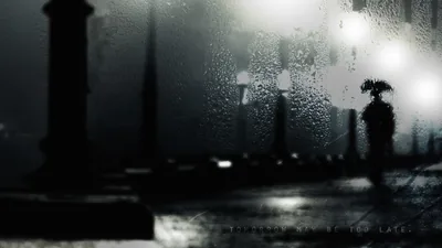 City Lamps Behind a Rainy Pane HD Wallpaper