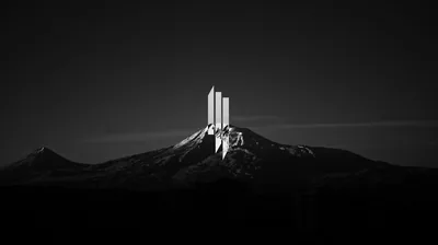 White Monolith on a Dark Peak HD Wallpaper