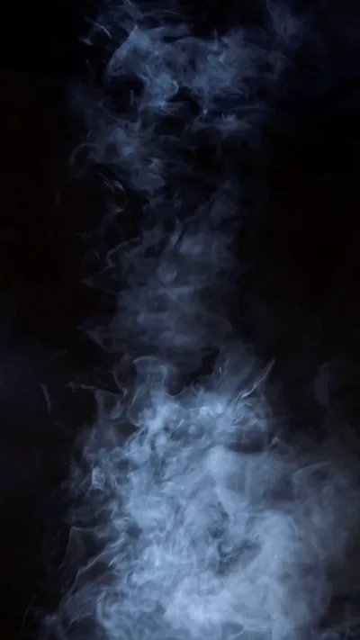 A black background with smoke coming out